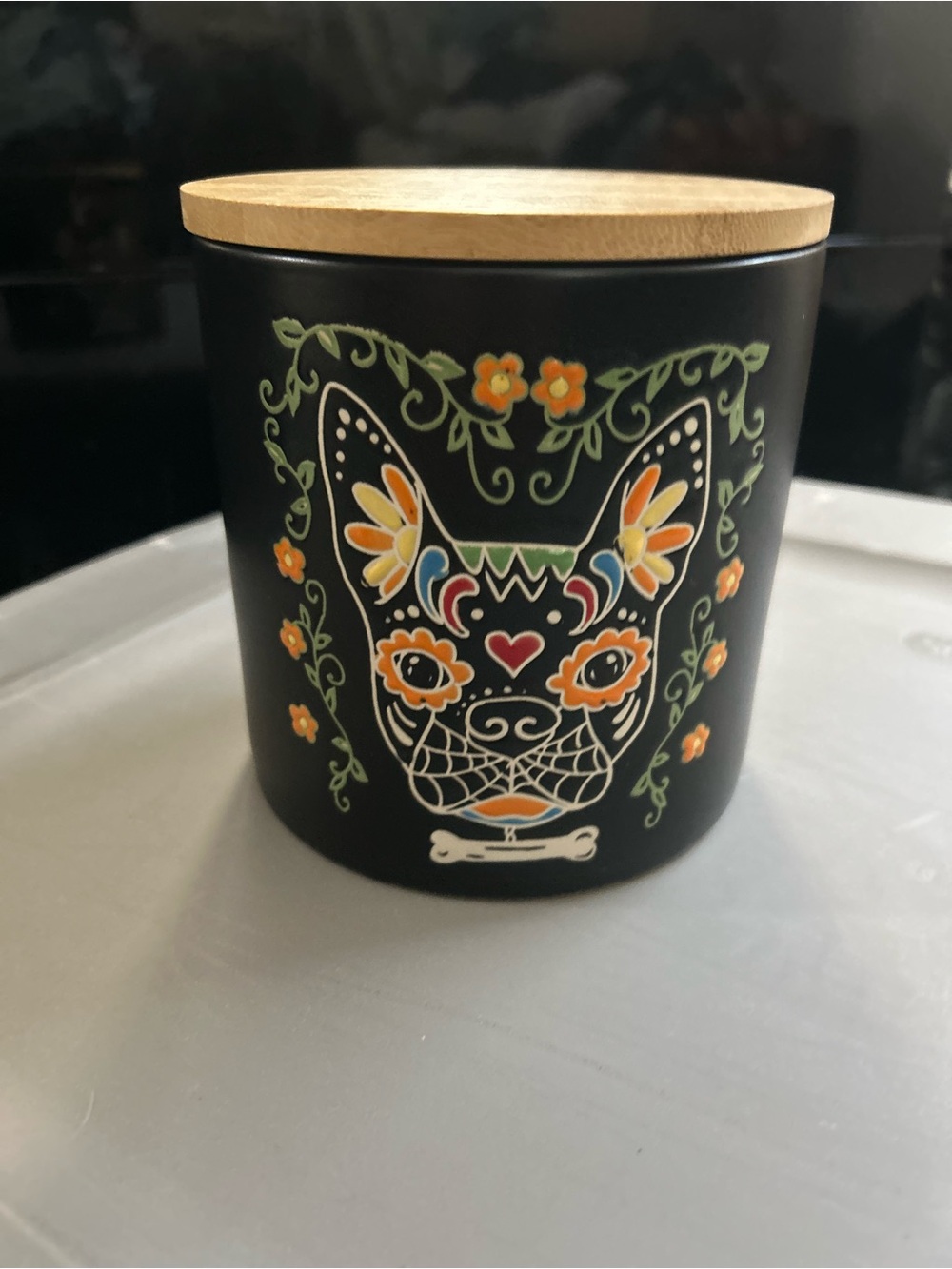Black Ceramic Canister with Floral Dog Artwork and Wood Lid